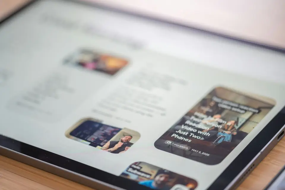 A tablet displaying a website with images and text content